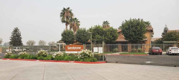 Entry sign to community l Sandstone Apartments in Fresno CA