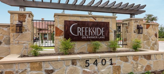 Entrance Sign at Creekside on Parmer Lane Apartment Homes in Austin, Texas, TX