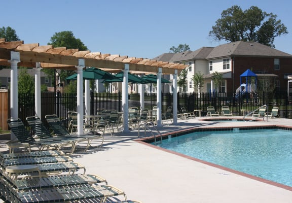 Outdoor Swimming Pool area with seating-University Place Apartments, Memphis, TN 38104
