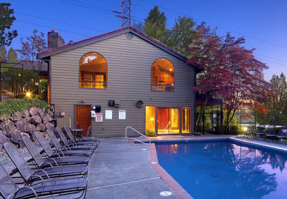 Exterior of Community Pool at night at Woodcliffe Apartment Homes in Renton Washington