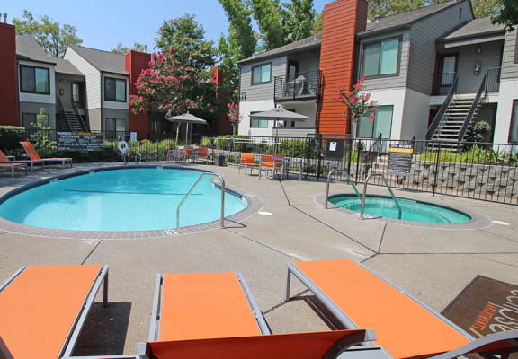 Pool and lounge chairs l Eclipse 96 Apartments in Fair Oaks CA