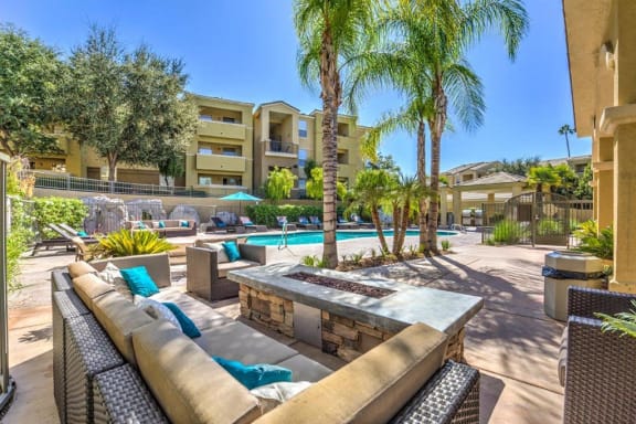 Thumbnail 11 of 37 - Apartments for Rent in Riverside, CA - Stone Canyon Apartments Outdoor Lounge with Firepit and Couches