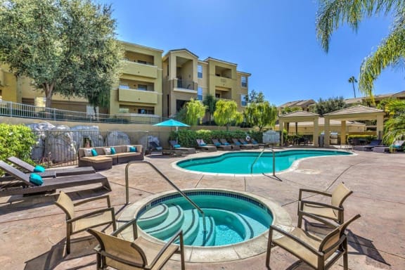 Thumbnail 9 of 37 - Apartments for Rent in Riverside - Stone Canyon Apartments Sparkling Pool with Hot Tub and Various Lounge Chairs