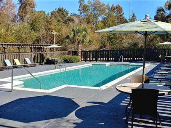 Lounge Chairs At Pool at Springwood Townhomes Apartments, Tallahassee