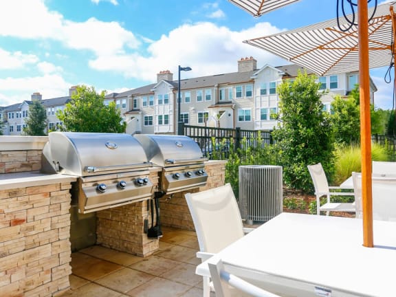 Thumbnail 9 of 39 - Outdoor entertaining zone complete with BBQ grills at Oasis Shingle Creek in Kissimmee, FL