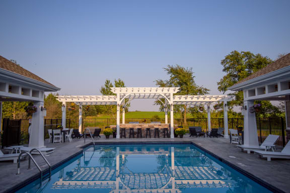 Outdoor Swimming Pool with Expansive Sundeck and Pergola