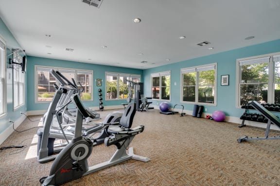 Fitness Center Overlooking The Pool Deck