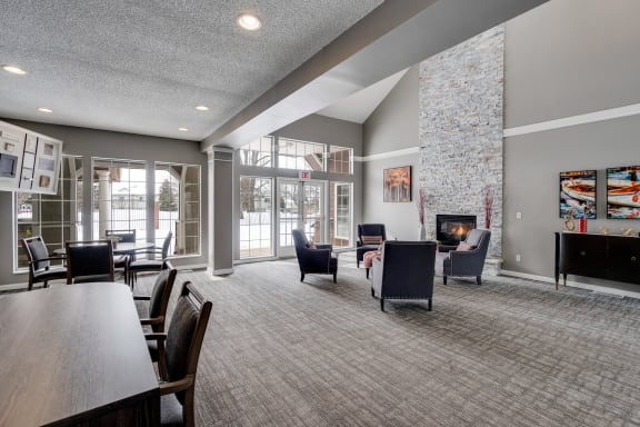 Open Concept Clubhouse Lounge Area With Large Windows & Vaulted Ceilings