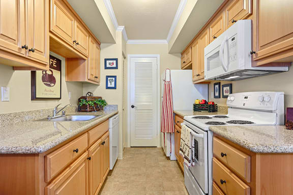 Fully Equipped Kitchen Includes Frost-Free Refrigerator, Electric Range, & Dishwasher Fully Equipped Kitchen Includes Frost-Free Refrigerator, Electric Range, & Dishwasher at Clayton Creek Apartments, Concord, CA, 94521