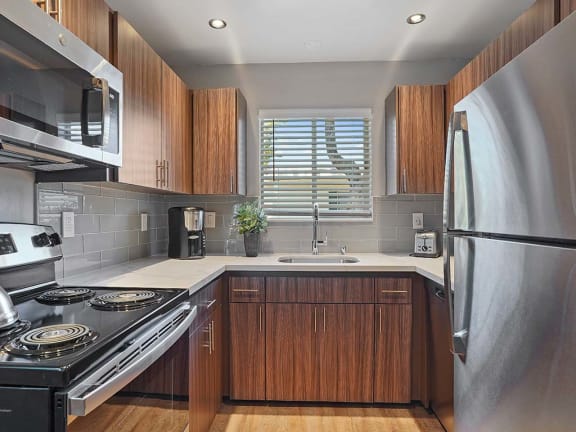 Upscale Stainless Steel Kitchen Appliances With Double Door Refrigerator at Colonial Garden Apartments, San Mateo