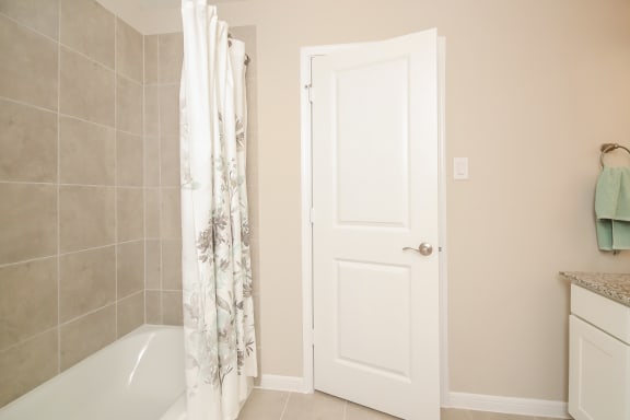 Large Soaking Tub In Master Bathroom With A Tile Surround Large Soaking Tub In Master Bathroom With A Tile Surround at Pradera Oaks, Bonney, TX, 77583