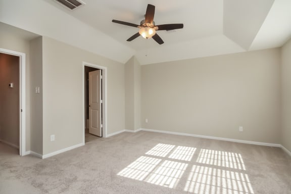 Spacious bedroom with ceiling fan at Pradera Oaks, Bonney