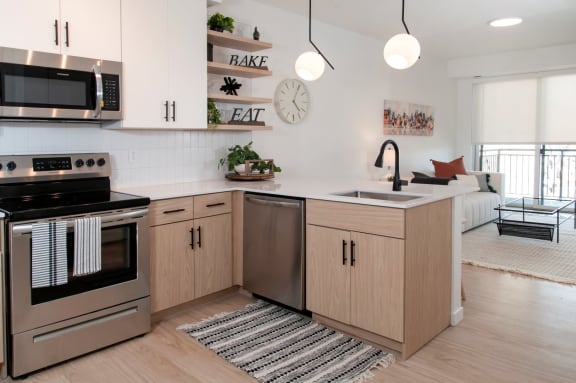 Kitchen With Custom Cabinetry at CityLine Apartments, Minneapolis, Minnesota