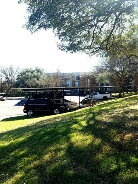 This is a photo of the covered parking in the parking lot at Cambridge Court Apartments in Dallas, TX