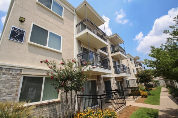 This is a photo of private patios and balconies at Midtown Apartments in Dallas, TX.