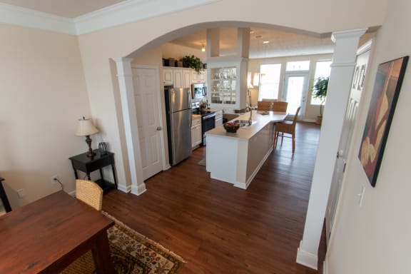 This is a photo looking inbto the kitchen from the dining room in the 1242 square foot, 2 bedroom Spinnaker floor plan at Nantucket Apartments in Loveland, OH.