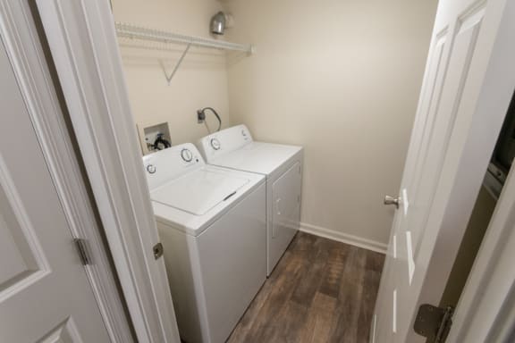 This is a photo of the utility closet (with washer and dryer connections) in the 1226 square foot 3 bedroom Hambletonian at Trails of Saddlebrook Apartments in Florence, KY.