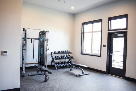 Free weights in 24 hour fitness center at Manor Way Apartments in Everett, WA 98204