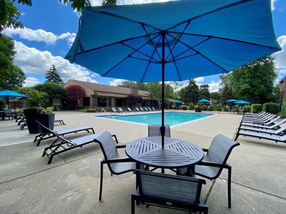 Heated pool with Relaxing Sundecks at Lakeside Village Apartments Clinton Township MI 48038