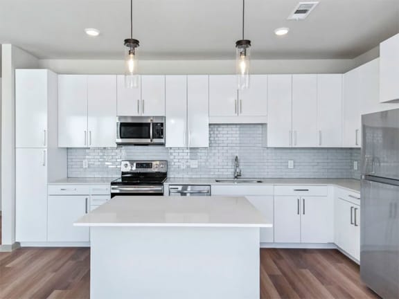 Chef Inspired Kitchen Islands with Designer Lighting at Pier 33 Apartments, Wilmington, 28401