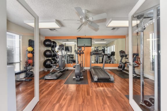 Fitness Center with Yoga Balls, Hardwood Inspired Floor,Treadmills, Ellipticals, and Excercise Bike