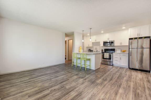 2x1 floor plan with Harwood inspired flooring through out the living room and kitchen areas. at Pinecrest Apartments, California