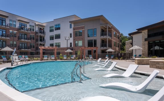 Poolside Relaxing Area at Link Apartments® Linden, North Carolina, 27517