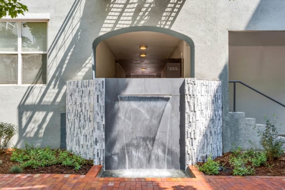 Building Exterior with Water Fountain in Stair Wall