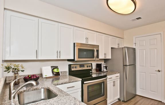 Renovated kitchen featuring stainless steel appliances at Saratoga Square, Springfield, Virginia