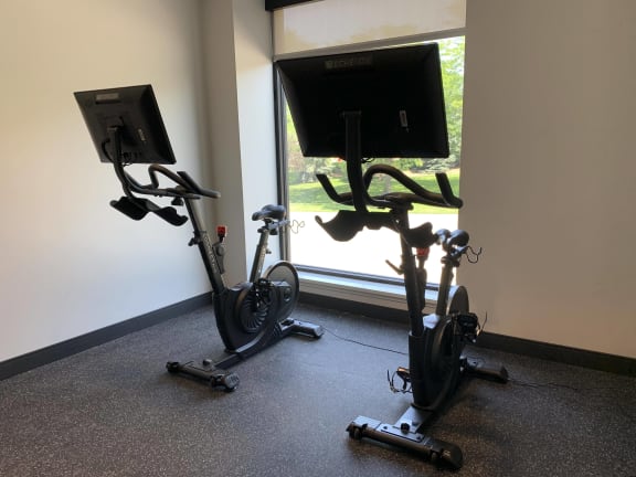 spin bikes with large screens for on demand cycling classes in the fitness center at Haven at Uptown