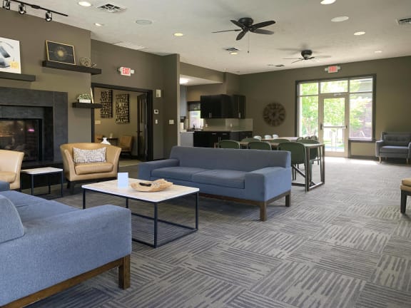 clubhouse tv lounge with couch and chair seating