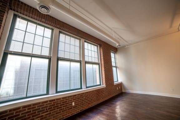 Floor To Ceiling Windows at Harness Factory Lofts, Managed by Buckingham Urban Living, Indiana, 46204