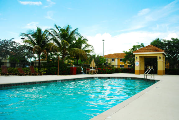 Pool with lounge chairs Captiva Club Miami Florida Apartments