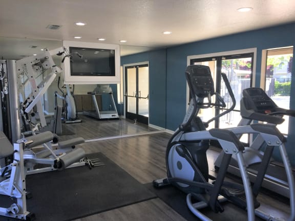 Fitness room with cardio equipment | Riverstone apts in Sacramento, CA 95831