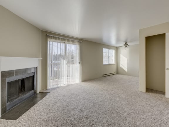 Large Living Room With Fireplace and Over sized Windows at Mirabella Apartments, 805 112th St SE, Everett, Washington
