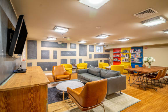 Community Room Area With Couches And Tables Wilber School Apartments.