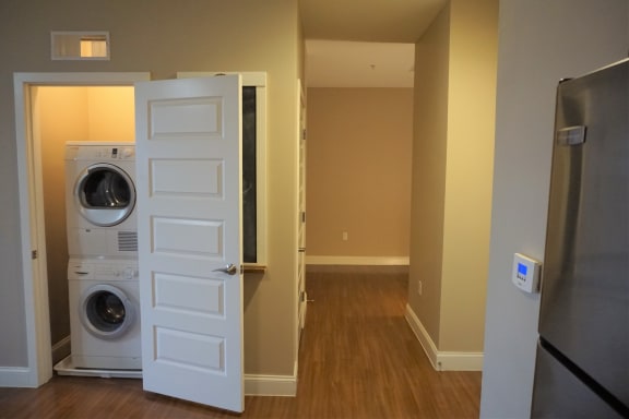 Stacked washer and dryer at Wilber School Apartments, Sharon