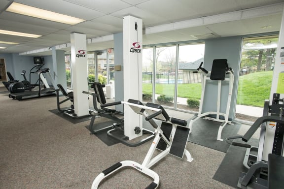 Fitness center with cardio and weightlifting equipment at Olde Towne Apartments in Middletown, OH