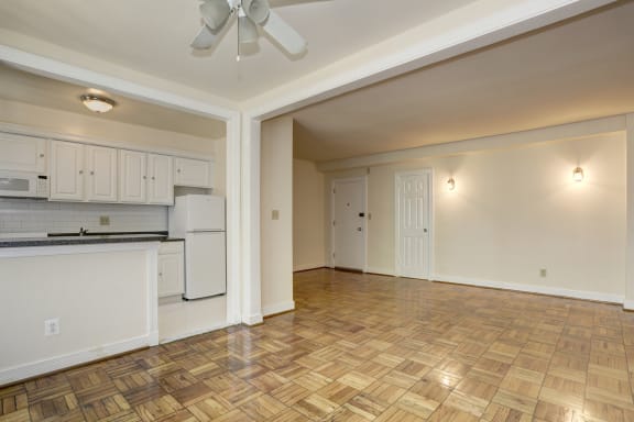 room with ceiling fan at wood floors  at Tivoli Gardens Apartments in Washington, DC