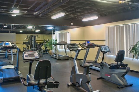 fitness center with cardio machines at Remington Place Apartments in Fort Washington, MD
