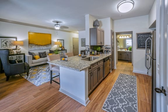 Fitted Kitchen With Island Dining at The Aster Sugar Land Apartments, Sugar Land, Texas
