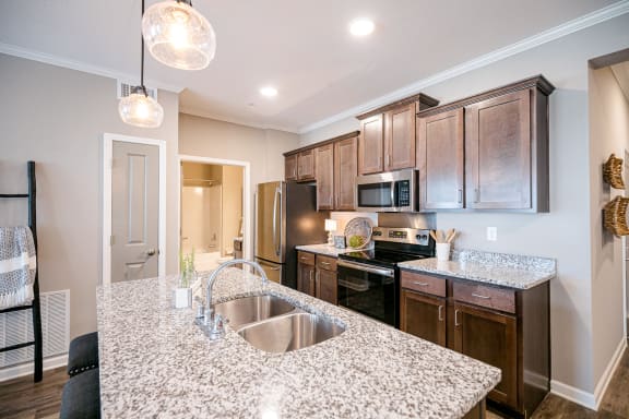 Kitchen Bar With Granite Counter Top at Meridian Park Apartments, Collierville, Tennessee