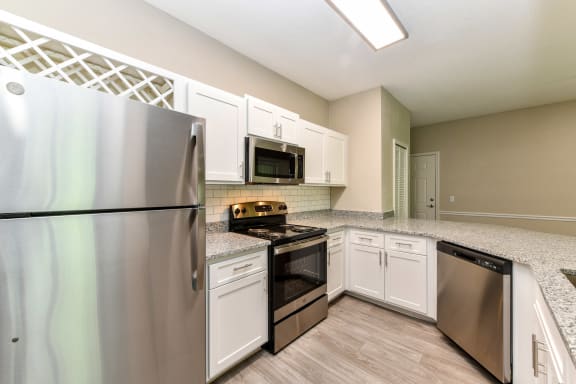 Fully Equipped Kitchen Includes Frost-Free Refrigerator, Electric Range, & Dishwasher at Paradise Island, Florida, 32256
