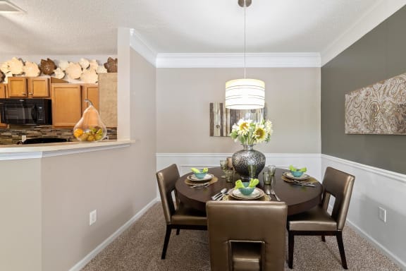 Model dining room at Sugarloaf Crossings Apartments in Lawrenceville, GA 30046