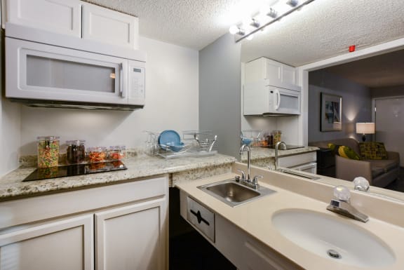 studio kitchen from bathroom at Plato's Cave Apartments Branson, MO 65616