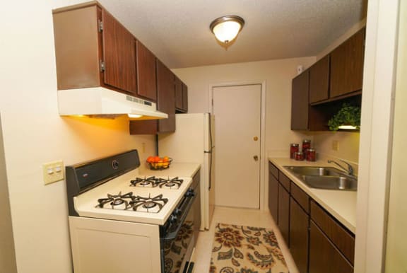 Kitchen with Gas Range at Swiss Valley Apartments in Wyoming, MI