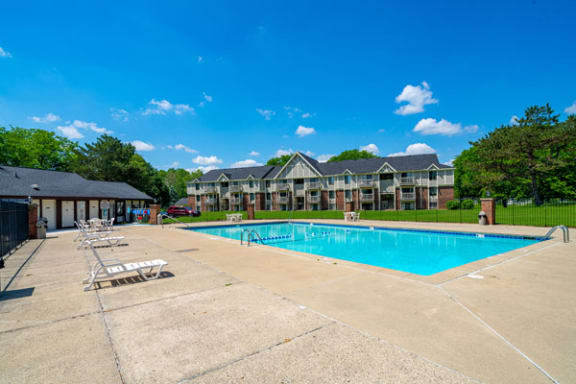 Refreshing Outdoor Pool with Large Sundeck at Waverly Park Apartments, Lansing, Michigan