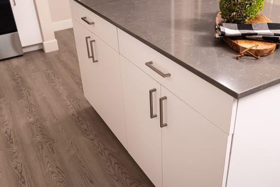 Wood-style flooring with carpeted bedrooms - NOVA at Green Valley