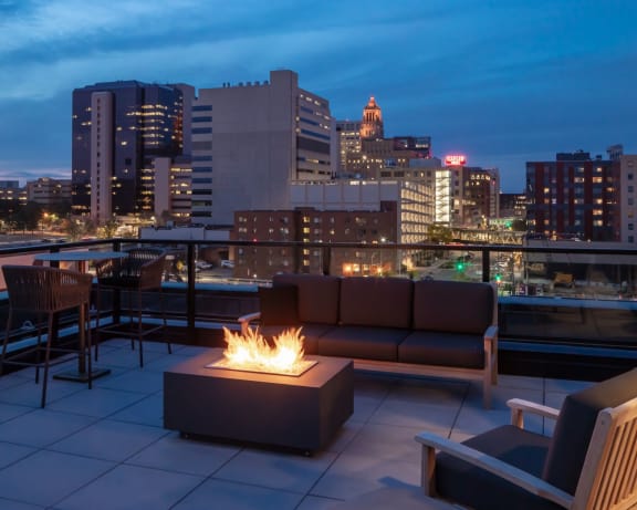 Deck View at The Maven on Broadway New Luxury Apartments in Downtown Rochester MN 55904 featuring Skydeck with Firepit and Stunning City Skyline Views