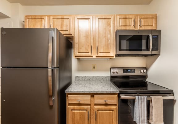Renovated kitchens with slate appliances at Ivy Hall Apartments in Towson MD